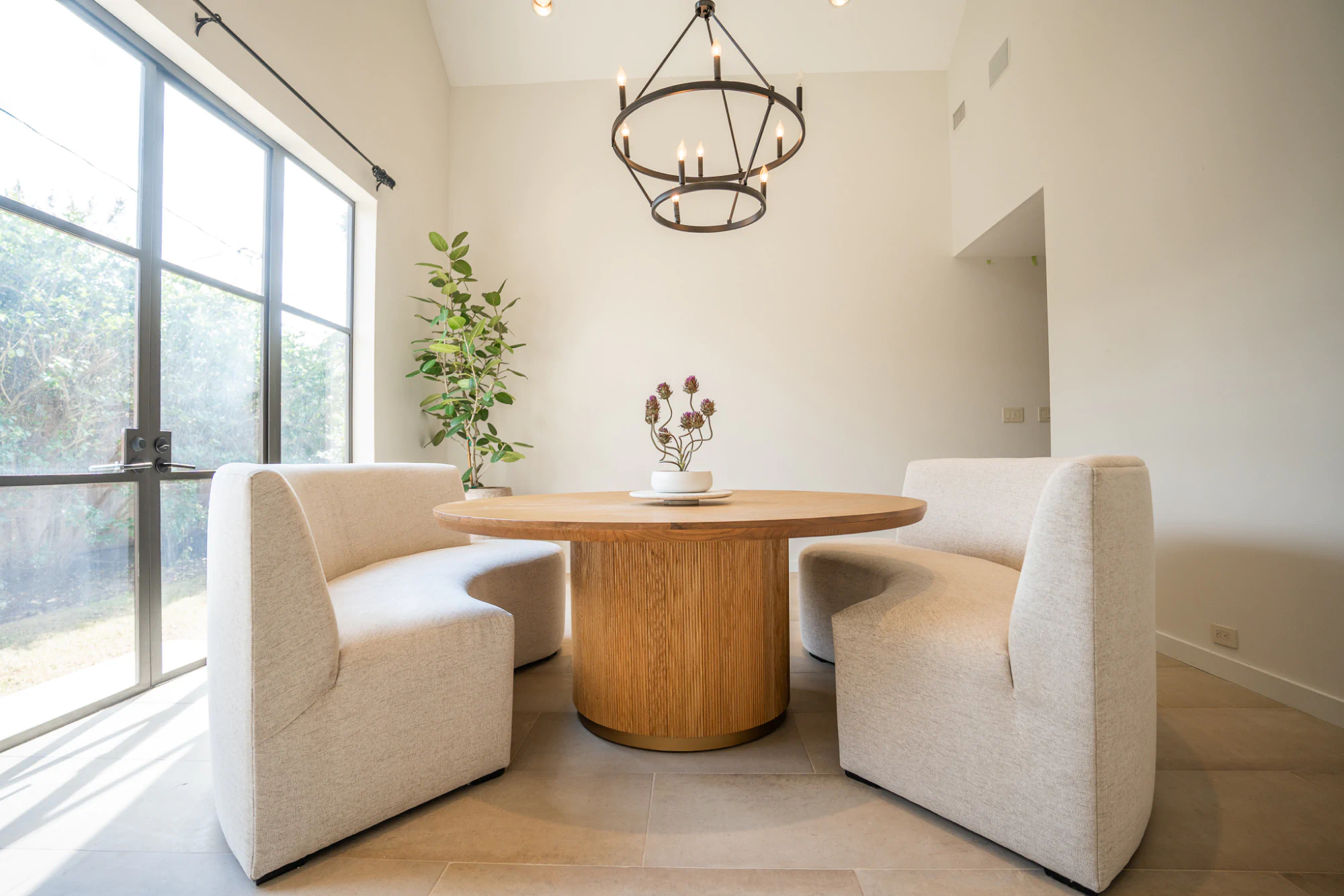 Custom dining banquette in a serene, minimalist Houston home interior